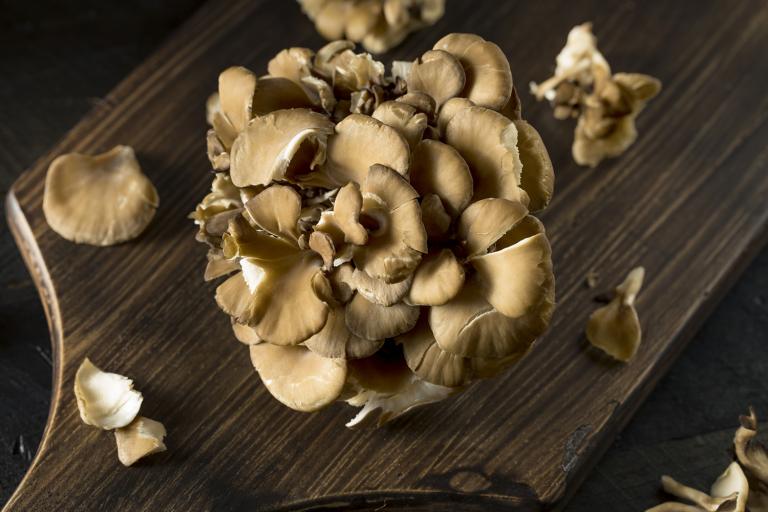 maitake mushroom on a cutting board